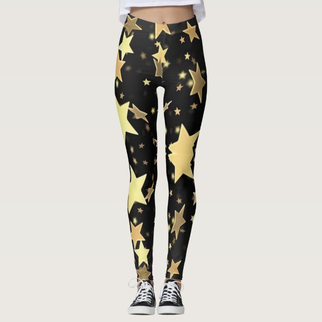 Gold Stars auf schwarzem Hintergrund Leggings (Vorderseite)