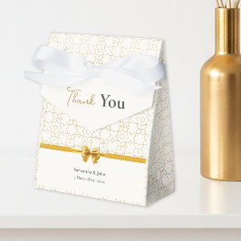 Gold- und Elfenbein-Art-Deco-Muster mit Schleifen- Geschenkschachtel