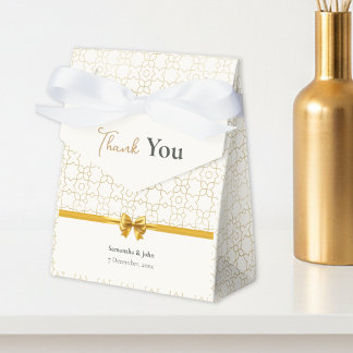 Gold- und Elfenbein-Art-Deco-Muster mit Schleifen- Geschenkschachtel
