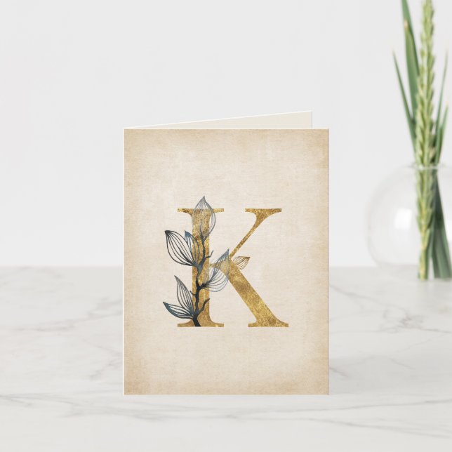Gold- und schwarzes K-Monogramm mit Blättern (Vorderseite)