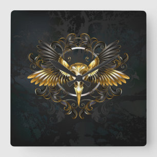 Golden Bird Skull auf schwarzem Hintergrund Quadratische Wanduhr