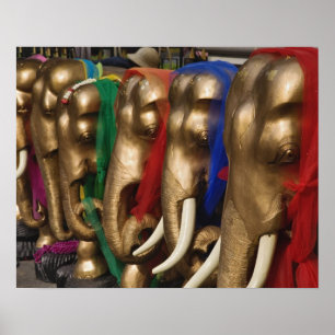 Golden elephants decorated with colorful poster