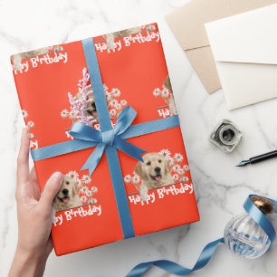 Golden Retriever auf Orange Geschenkpapier