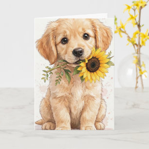 Golden Retriever-Welpe hält eine Sonnenblumenkarte Karte