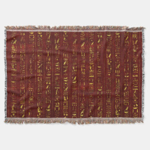 Goldene ägyptische Hieroglyphen auf rotem Leder Decke