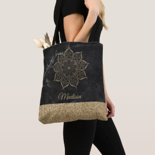 Goldene falsche Glitter-Mandala auf schwarzem Marm