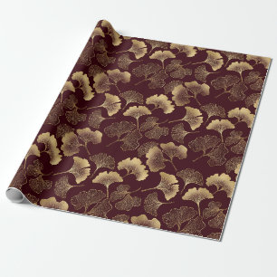 Goldene Ginkgoblätter auf roter eleganter Botanik Geschenkpapier