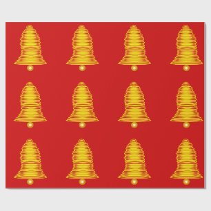 Goldene Glocken auf rotem Geschenkpapier