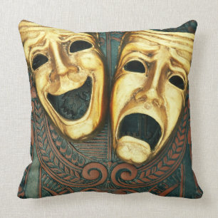 Goldene Komödien- und Tragödiemasken auf Kissen