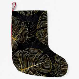 Goldene Monstera-Blätter, romantisches nahtloses B Kleiner Weihnachtsstrumpf