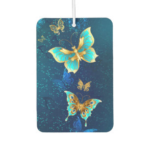 Goldene Schmetterlinge auf blauem Hintergrund Autolufterfrischer