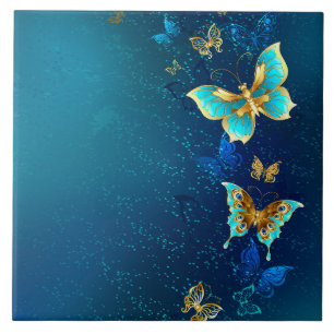Goldene Schmetterlinge auf blauem Hintergrund Fliese