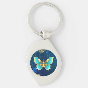 Goldene Schmetterlinge auf blauem Hintergrund Schlüsselanhänger