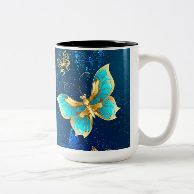 Goldene Schmetterlinge auf blauem Hintergrund Zweifarbige Tasse (Rechts)