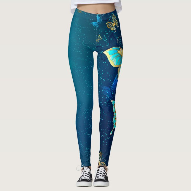 Goldene Schmetterlinge auf einem blauen Hintergrun Leggings (Vorderseite)