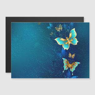 Goldene Schmetterlinge auf einem blauen Hintergrun Magneteinladung