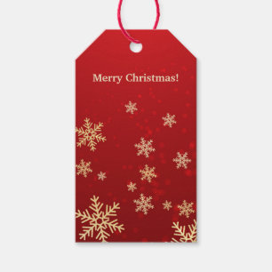 Goldene Schneeflocken auf roten Weihnachtsgeschenk Geschenkanhänger