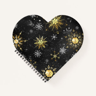 Goldene Schneeflocken auf schwarzem Hintergrund Notizbuch