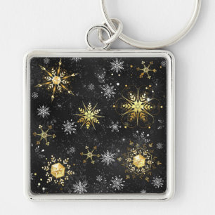 Goldene Schneeflocken auf schwarzem Hintergrund Schlüsselanhänger