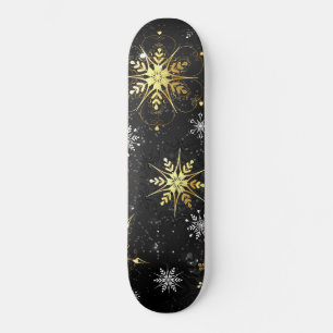 Goldene Schneeflocken auf schwarzem Hintergrund Skateboard