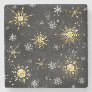 Goldene Schneeflocken auf schwarzem Hintergrund Steinuntersetzer