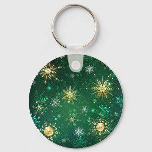 Goldene Schneeflocken im grünen Hintergrund Schlüsselanhänger