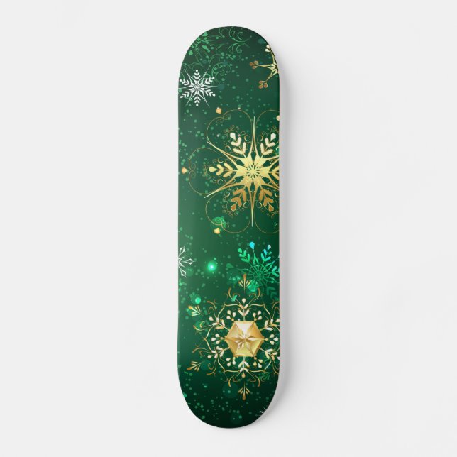 Goldene Schneeflocken im grünen Hintergrund Skateboard (Vorderseite)