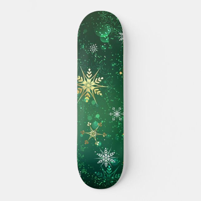 Goldene Schneeflocken im grünen Hintergrund Skateboard (Vorderseite)