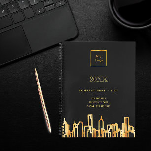 Goldene Stadt-Skyline schwarzes geschäftliches pro Notizbuch
