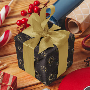 Goldene Sterne leuchten auf schwarzem Muster Geschenkpapier