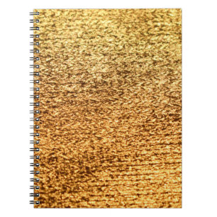 Goldene Textilien: glamouröser Makro-Hintergrund. Notizblock