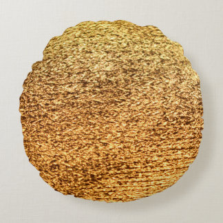 Goldene Textilien: glamouröser Makro-Hintergrund. Rundes Kissen