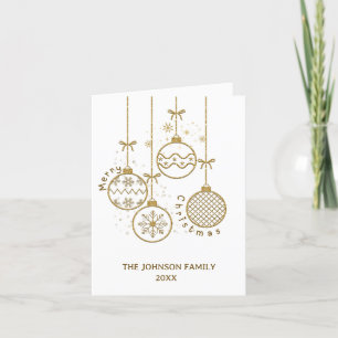 Goldene Weihnachtsbälle außerhalb des Fotos Feiertagskarte