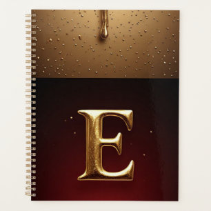 Goldener Buchstabe E Monogramm mit tropfender Meta Planer