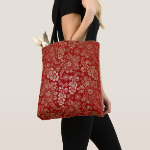 Goldener Luxus-Paisley auf Rubinrotem Hintergrund