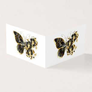 Goldener Schmetterling mit schwarzem Orchid