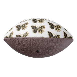 Goldener Schmetterling mit schwarzem Orchid Football