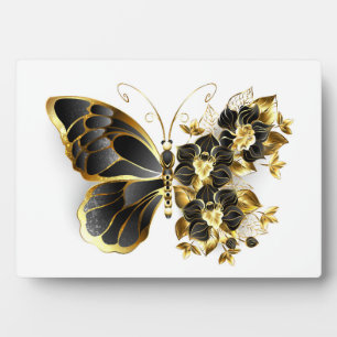 Goldener Schmetterling mit schwarzem Orchid Fotoplatte
