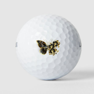 Goldener Schmetterling mit schwarzem Orchid Golfball