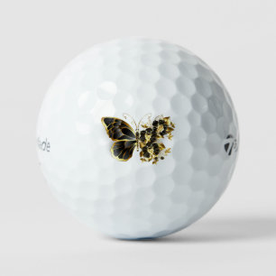 Goldener Schmetterling mit schwarzem Orchid Golfball