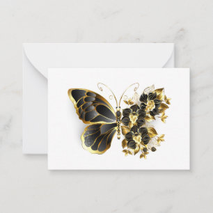Goldener Schmetterling mit schwarzem Orchid Hinweiskarte