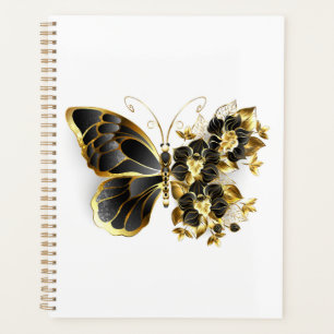 Goldener Schmetterling mit schwarzem Orchid Planer