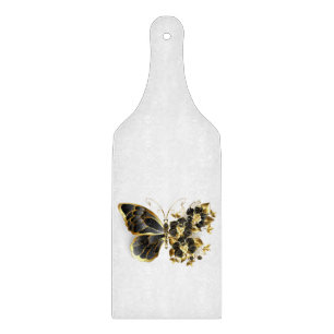 Goldener Schmetterling mit schwarzem Orchid Schneidebrett