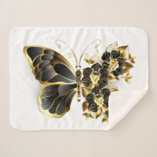 Goldener Schmetterling mit schwarzem Orchid Sherpadecke