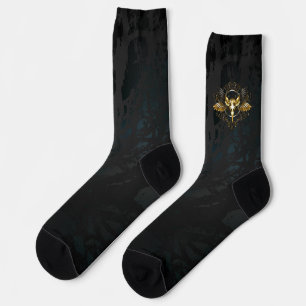 Goldener Vogelschädel auf schwarzem Hintergrund Socken