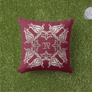 goldenes Element mit Blumendach.monogramm. Kissen