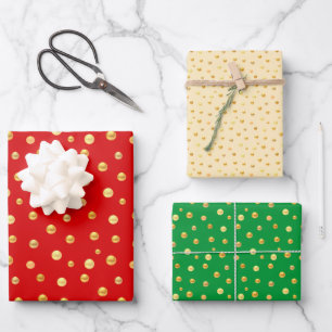 Goldenes Konfetti auf goldenem, grünem und rotem  Geschenkpapier Set