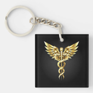 Goldenes polygonales Symbol Caduceus Schlüsselanhänger