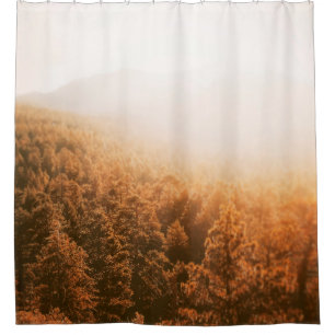 GOLDETE SONNE ÜBER EINEM WALD DUSCHVORHANG
