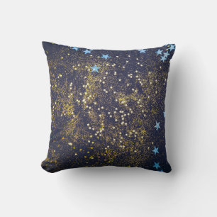 Goldglitter und glitzernde blaue Sterne auf schwar Kissen